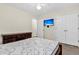 Bedroom showcasing neutral walls, a TV, a ceiling fan, and a double door closet at 2919 Fernwood Dr, North Charleston, SC 29406