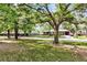 Charming home with mature trees providing shade and a well-maintained lawn at 2919 Fernwood Dr, North Charleston, SC 29406