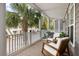 Enjoy outdoor living on this spacious balcony with seating area and view of palm trees at 3019 Fraserburgh Way, Mount Pleasant, SC 29466