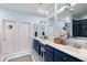 Stylish bathroom features dual sinks, blue cabinets, and a walk-in closet at 3019 Fraserburgh Way, Mount Pleasant, SC 29466