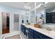 Stylish bathroom features dual sinks, blue cabinets, and a walk-in closet at 3019 Fraserburgh Way, Mount Pleasant, SC 29466