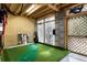 Unique indoor golf setup with putting green, lattice wall accents, and exposed wooden ceiling beams at 3019 Fraserburgh Way, Mount Pleasant, SC 29466