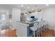 Well-equipped kitchen with bar seating, stainless steel appliances and ample storage at 3019 Fraserburgh Way, Mount Pleasant, SC 29466