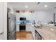 Modern kitchen with stainless steel appliances, granite countertops, and stylish backsplash at 3019 Fraserburgh Way, Mount Pleasant, SC 29466