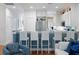 Eat-in kitchen with bar seating, white cabinets, and stainless steel refrigerator at 3019 Fraserburgh Way, Mount Pleasant, SC 29466