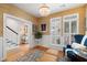 Inviting living room with hardwood floors, area rug, and an elegant chandelier at 3019 Fraserburgh Way, Mount Pleasant, SC 29466