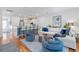 Open concept living room with hardwood floors, a ceiling fan, and large white sofa at 3019 Fraserburgh Way, Mount Pleasant, SC 29466