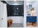 Modern shower features dark subway tile, a bench, and built-in shelving at 3019 Fraserburgh Way, Mount Pleasant, SC 29466