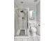 Clean bathroom features a glass-enclosed shower with white tiled walls at 3084 Queensgate Way, Mount Pleasant, SC 29466