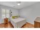 Comfortable bedroom with hardwood floors, natural light, and a ceiling fan at 3084 Queensgate Way, Mount Pleasant, SC 29466