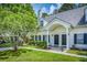 Charming home with a manicured lawn, lovely landscaping and a covered entrance at 3084 Queensgate Way, Mount Pleasant, SC 29466
