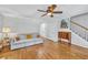 Comfortable living room featuring wood floors and a plush sofa at 3084 Queensgate Way, Mount Pleasant, SC 29466