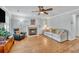 Cozy living room with hardwood floors, fireplace, and comfortable seating at 3084 Queensgate Way, Mount Pleasant, SC 29466