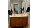 Bathroom featuring a double sink vanity, wood cabinets, modern fixtures and gray paint at 310 Flyway Rd, Goose Creek, SC 29445