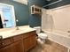 Bathroom features a single vanity, standard toilet, and a shower-tub combo with tiled walls at 310 Flyway Rd, Goose Creek, SC 29445
