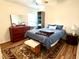 Bedroom with ceiling fan, window, dresser, and a blue comforter set at 310 Flyway Rd, Goose Creek, SC 29445