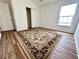 Bedroom with a large rug, one window, and closet with sliding doors at 310 Flyway Rd, Goose Creek, SC 29445