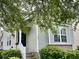 Charming home with gray siding, white trim, inviting entrance, and well-manicured landscaping at 310 Flyway Rd, Goose Creek, SC 29445