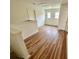 Hallway with laminate wood flooring and two windows providing natural light at 310 Flyway Rd, Goose Creek, SC 29445