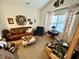 Cozy living room with a leather sofa, decorative decor, and an area rug over wood flooring at 310 Flyway Rd, Goose Creek, SC 29445