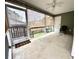 Screened porch with concrete flooring, white ceiling fan, and backyard view at 310 Flyway Rd, Goose Creek, SC 29445