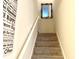 Stairway with beige carpet and a gold mirror on the wall at 310 Flyway Rd, Goose Creek, SC 29445