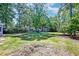 Expansive backyard with lush greenery, mature trees, and a charming storage shed, perfect for outdoor enjoyment at 3298 Heathland Way, Mount Pleasant, SC 29466