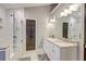 Luxurious bathroom featuring a double vanity, sleek fixtures, and a glass-enclosed shower at 3298 Heathland Way, Mount Pleasant, SC 29466