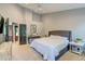 Serene bedroom features plush carpet, neutral paint, and ample natural light with dark doors at 3298 Heathland Way, Mount Pleasant, SC 29466