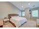 Bright bedroom features plush carpet, neutral paint, and ample natural light from large windows at 3298 Heathland Way, Mount Pleasant, SC 29466