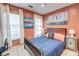 Cozy bedroom features a modern bed frame, neutral carpet, and plenty of natural light from the two windows at 3298 Heathland Way, Mount Pleasant, SC 29466