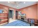 A cozy bedroom with a large bed, a large shelving unit, a desk, and an attached bathroom and closet at 3298 Heathland Way, Mount Pleasant, SC 29466