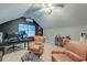 Great bonus space in the attic, complete with two chairs, an office, mini split, and hardwood floors at 3298 Heathland Way, Mount Pleasant, SC 29466