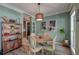 Stylish dining room with hardwood-style floors, modern lighting, and elegant decor at 3298 Heathland Way, Mount Pleasant, SC 29466