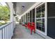 Inviting covered front porch with ample seating offering an excellent place to unwind at 3298 Heathland Way, Mount Pleasant, SC 29466
