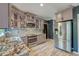 Updated kitchen with stainless steel appliances, stylish backsplash, and granite countertops at 3298 Heathland Way, Mount Pleasant, SC 29466