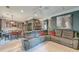 Open living room with a ceiling fan, crown molding, gray walls, and a comfy sectional sofa at 3298 Heathland Way, Mount Pleasant, SC 29466