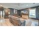 Comfortable living room with plush sectional sofa, modern decor, and bright natural light at 3298 Heathland Way, Mount Pleasant, SC 29466
