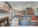 Open living room with a fireplace, gray walls, and gray sofa, offering a warm, inviting space at 3298 Heathland Way, Mount Pleasant, SC 29466