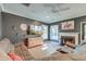 Comfortable living room featuring a fireplace, hardwood-style floors, and a ceiling fan at 3298 Heathland Way, Mount Pleasant, SC 29466