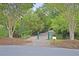 Inviting entrance to a serene nature path with lush greenery, offering a peaceful escape at 3298 Heathland Way, Mount Pleasant, SC 29466
