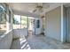 Relaxing screened porch with ceiling fan and view of the outdoors, providing a comfortable space at 3298 Heathland Way, Mount Pleasant, SC 29466