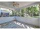 Screened-in porch with ceiling fan, providing an airy, pest-free outdoor living area at 3298 Heathland Way, Mount Pleasant, SC 29466