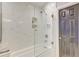 The tiled shower features a glass partition, built-in niche, and a shower head at 3298 Heathland Way, Mount Pleasant, SC 29466