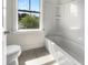 Bathroom features a shower-tub combination, tile flooring and a window at 350 Oak Park St, Summerville, SC 29486