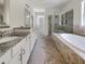 Bathroom featuring double vanities, a soaking tub, and a separate shower at 350 Oak Park St, Summerville, SC 29486