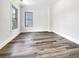 A bright bedroom with hardwood floors, two windows and white walls at 350 Oak Park St, Summerville, SC 29486