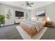 Serene bedroom with a ceiling fan, plush rug, neutral colors, and natural light from two windows at 350 Oak Park St, Summerville, SC 29486
