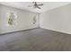 A bright bedroom with gray carpet, two windows and white walls at 350 Oak Park St, Summerville, SC 29486