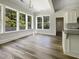 Sun-filled dining area with a modern chandelier and views of the backyard at 350 Oak Park St, Summerville, SC 29486